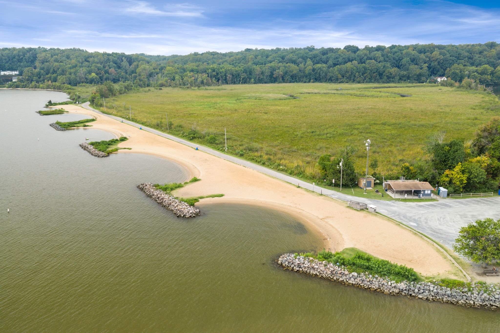 Aerial view of a community pool complex with cabanas