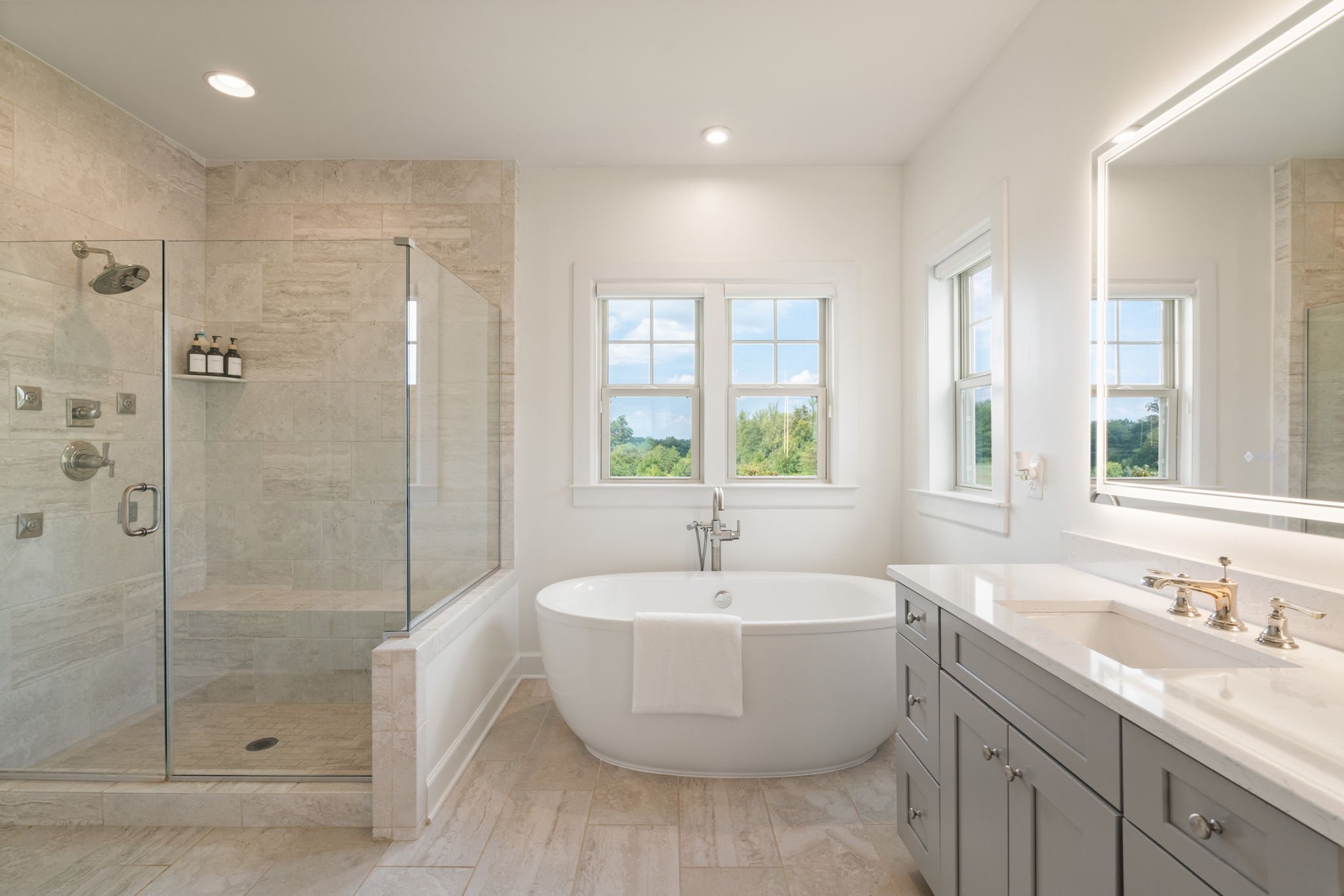 Primary bathroom with freestanding tub and glass walk-in shower
