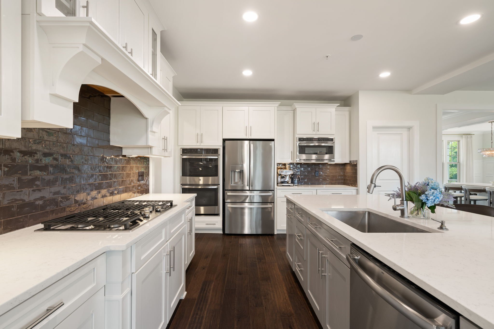 Kitchen detail with glazed tile backsplash and stainless appliances