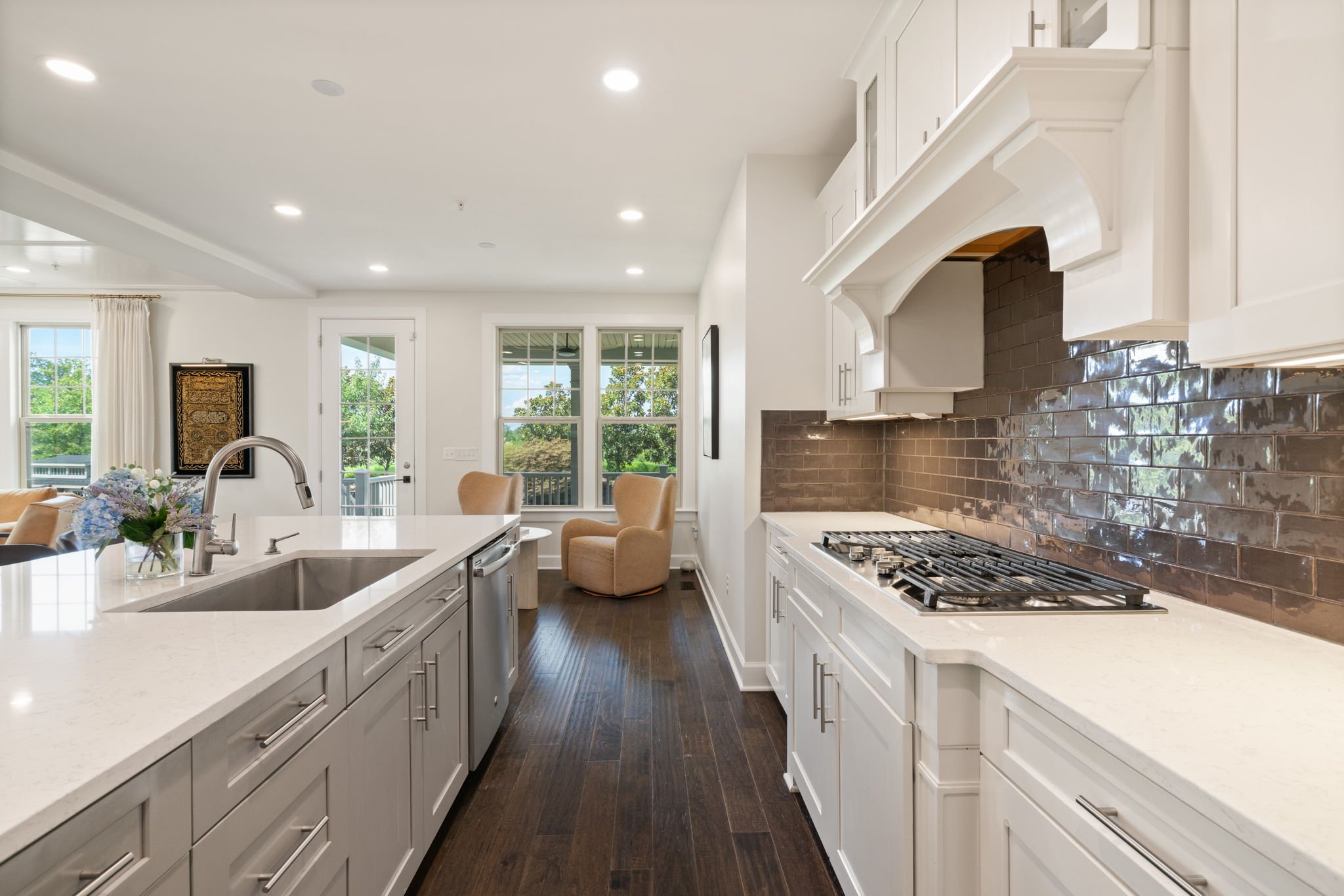 Galley-style kitchen view toward the cooktop and cabinetry