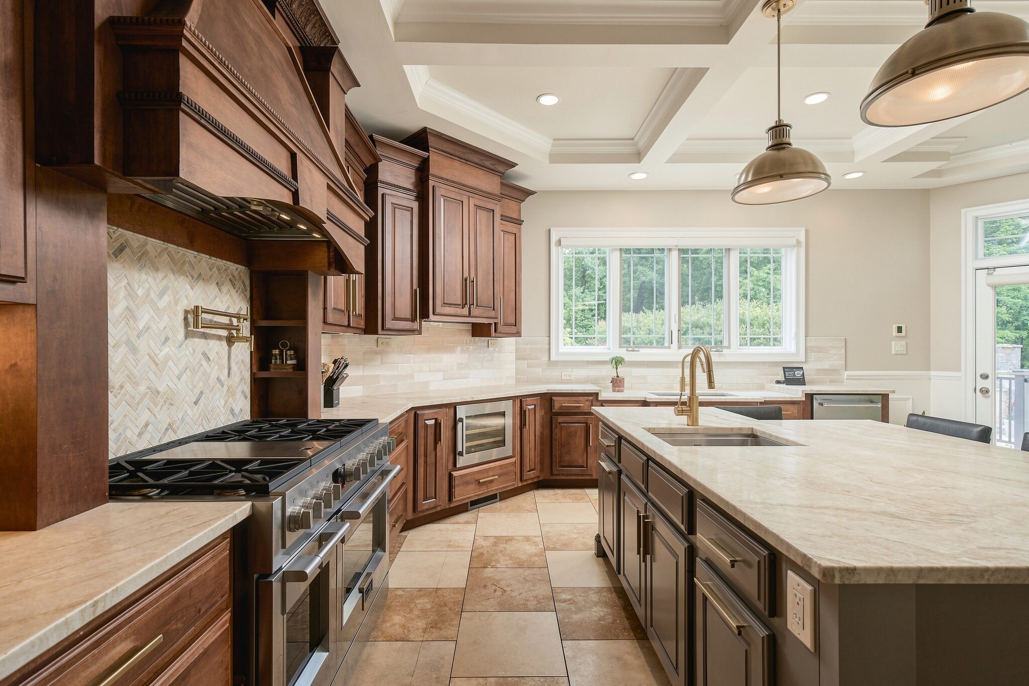 Kitchen island opening onto the dining table and living room beyond